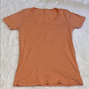 Peachy colored shirt